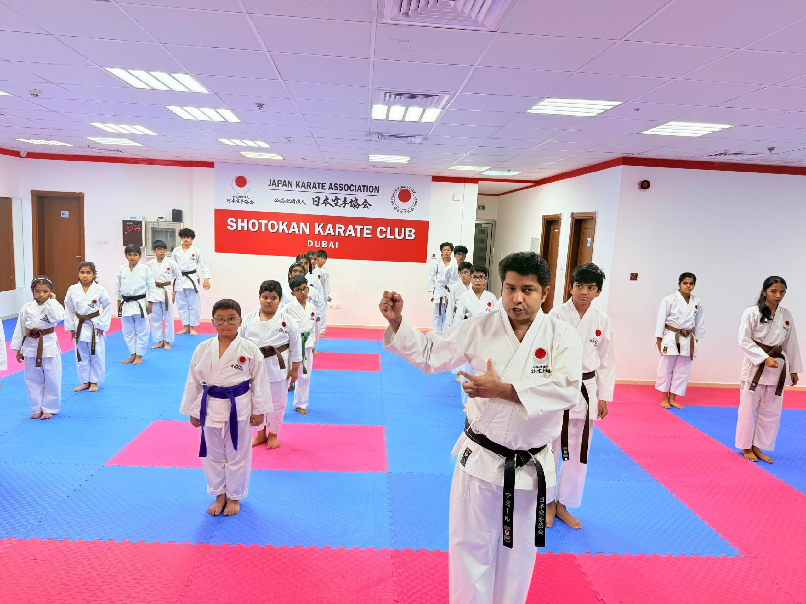 Sensei Ameer teaching kids karate classes in Dubai at JKA Shotokan Karate Club