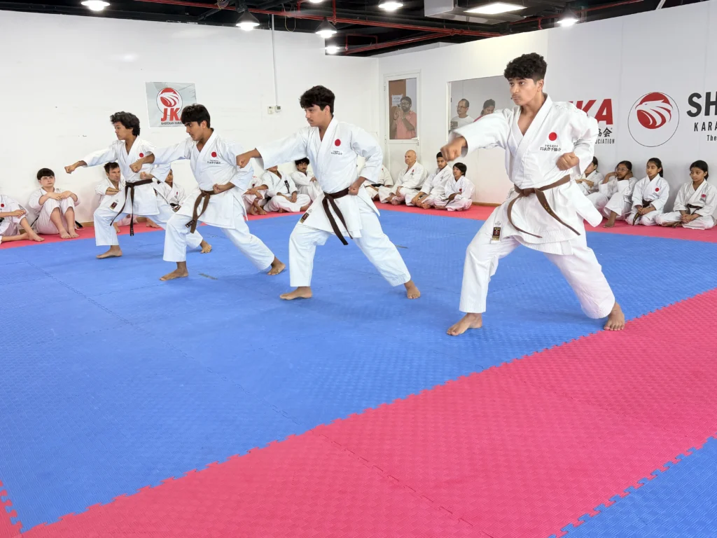 Kids performing a JKA Shotokan karate examination in Dubai